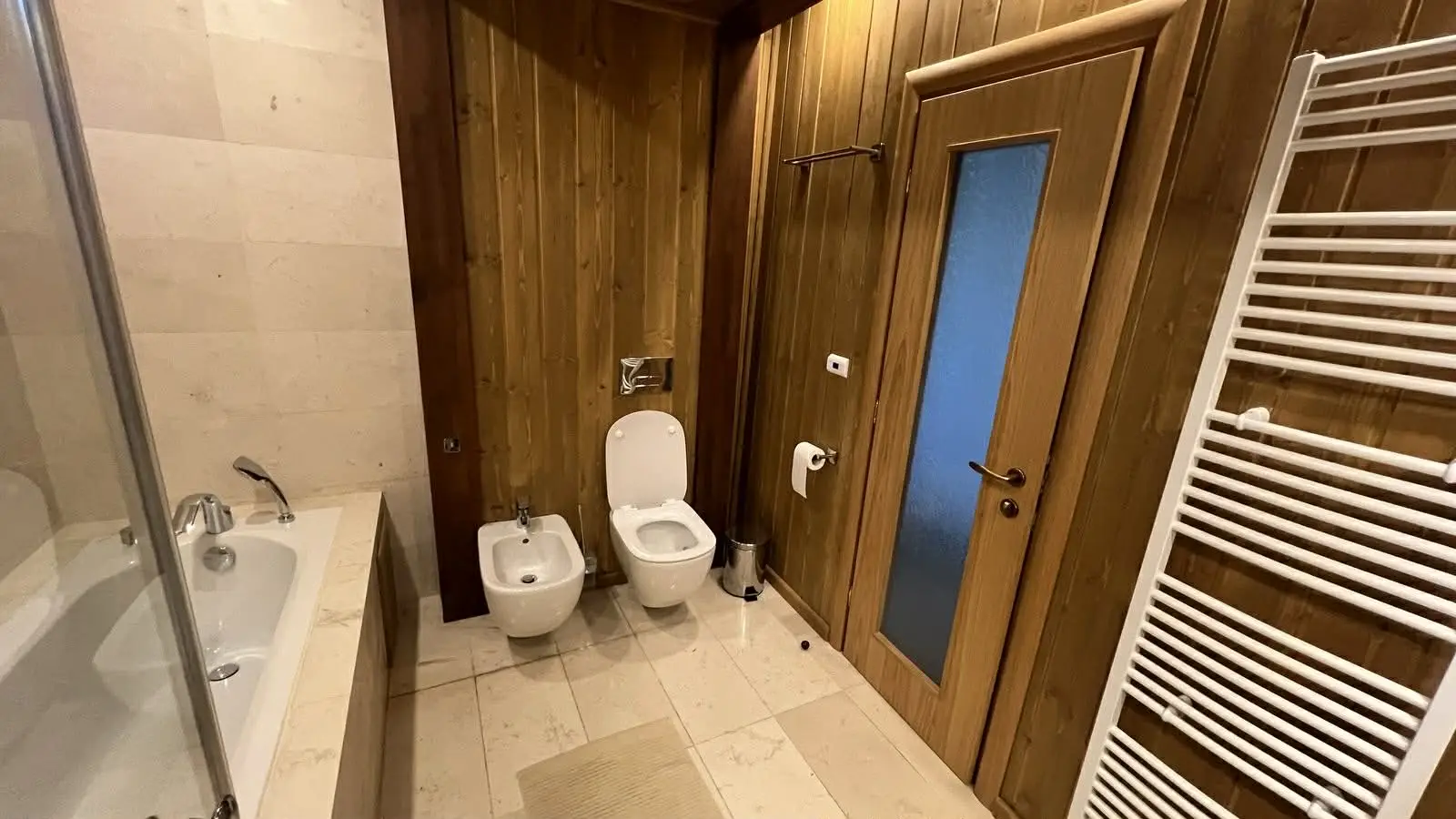 Modern bathroom with a shower and bathtub.