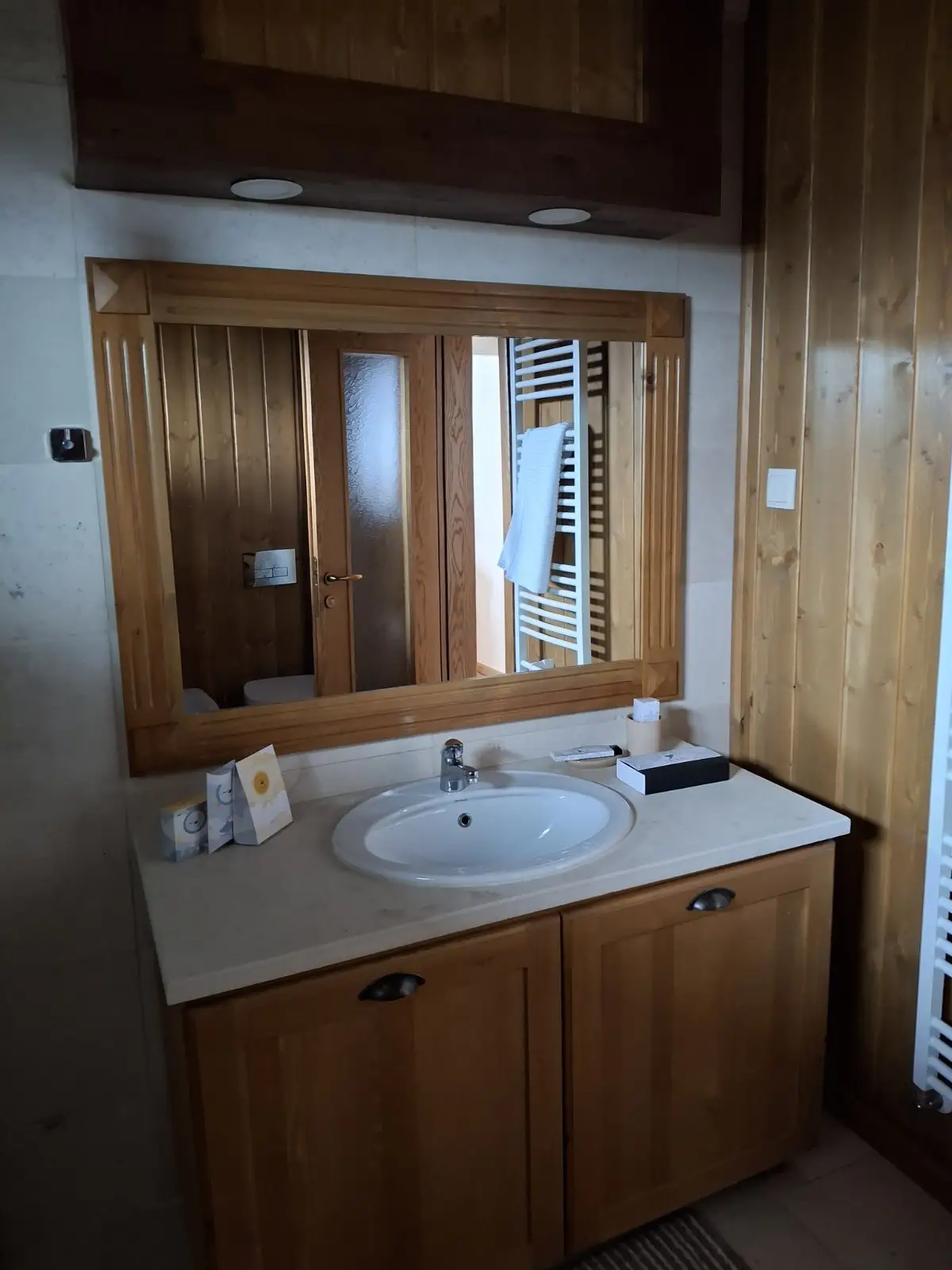 Bright bathroom with a bathtub and glass shower.